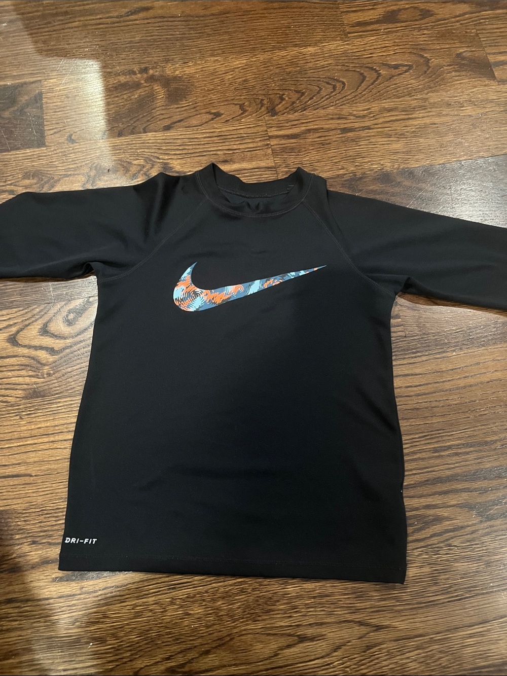 Nike Black Kids Swim Rashguard with Blue & Orange Swoosh Pattern